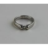 An 18ct. white gold and solitaire diamond ring, set round brilliant cut diamond (diamond weight