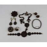 A collection of gilt and white metal garnet set jewellery, to include; A white metal and garnet