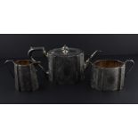A Victorian three piece silver tea service, by Richard Martin & Ebenezer Hall, assayed London