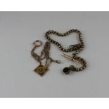 Two pinchbeck Albert chains, the first with 'T' bar and with swivel fob to one end, length 16.5cm,
