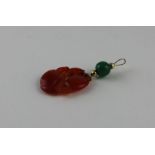 Chinese yellow metal and red jade pendant, having red jade pendant fashioned as stylised fruits to