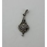 An Art Deco yellow and white metal, diamond and seed pearl pendant, the open work fan shaped pendant
