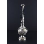 An Islamic white metal rose water sprinkler, 20th century, having circular bulbous body with