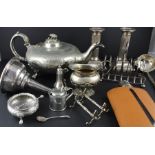A collection of silver wae, to include; A Victorian silver six section toast rack, assayed Chester