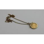 A 1913 George V gold half sovereign, London mint, within 9ct. gold scroll top circular pendant
