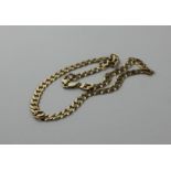 A 9ct. gold link chain, formed from faceted flat ovoid links, with lobster claw clasp, impressed "