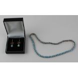 A silver and opal and cubic zirconia choker necklace, formed from a series of alternating links four