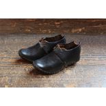 A pair of 19th century children's leather clogs.