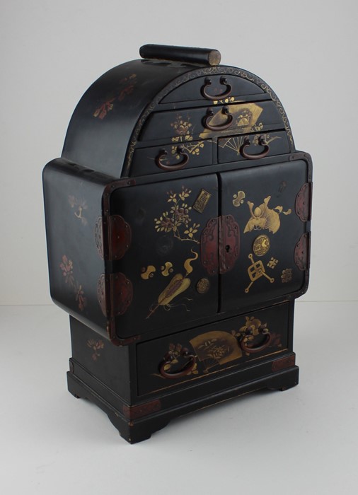 A 19th century Japanese lacquered table top jewellery cabinet, decorated gold and red on black