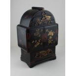 A 19th century Japanese lacquered table top jewellery cabinet, decorated gold and red on black
