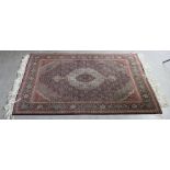 (1) A 20th cent Islamic Qum woollen rug, 200cm x 150cm