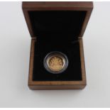 An Elizabeth II 2008 gold proof one pound coin, being 19.61g of 22ct, gold, rev. Royal Arms, in