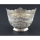 A Kutch silver sugar bowl, of navette form, repousse, chased and engraved foliate decorated to