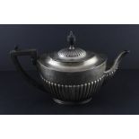 An Edwardian silver teapot, by William Hutton & Sons Ltd, assayed London 1903, of oval form with