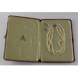 An Art Deco style three string pearl necklace collar necklace, having three graduated lengths of