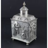 A Dutch silver rectangular tea caddy, 19th century, the sides repousse pastoral scenes, with pull