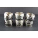 A set of six Iraqi white metal Niello circular napkin rings, having niello work concave side, each