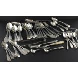 A large collection of silver flatware, to include; Five table spoons, a pair of George IV fiddle
