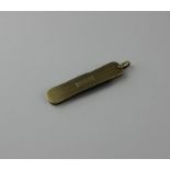 A 14ct. gold penknife, the waisted gold side plates with linear engine turned decoration, fitted