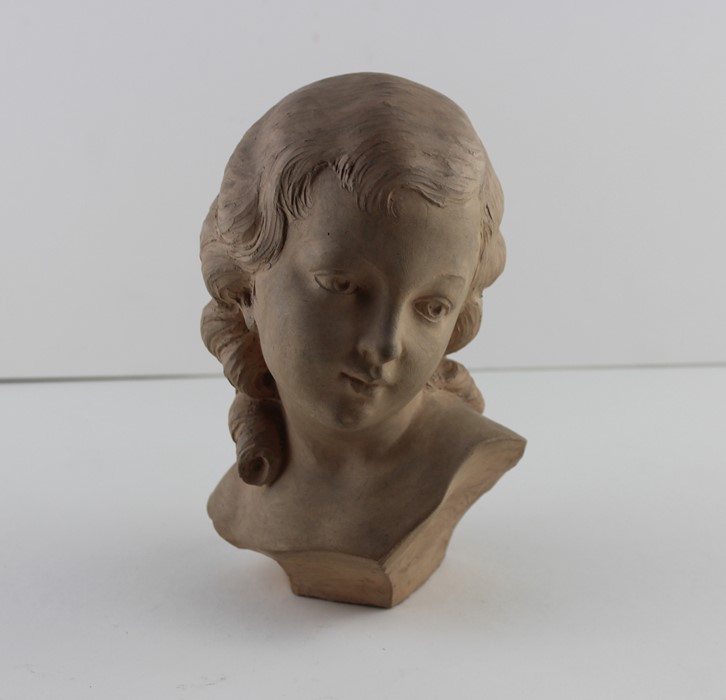 Corinne Gobet (contemporary), a terracotta bust of a young woman, signed, height 17cm.