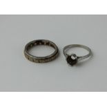 A platinum and diamond ring, the stepped band flush set round cut diamonds, impressed "Plat",