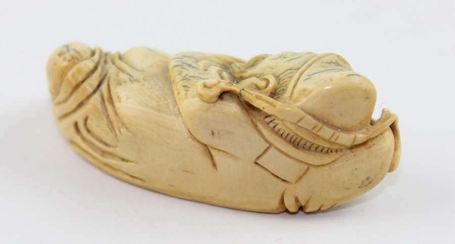 A late 19th century Chinese ivory Lohan, the recognisable figure in recumbent pose, 6.5 cm long - Image 2 of 5