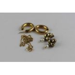 A pair of 9ct. gold hoop earrings, of hollow ovoid form, hallmarked for 9ct. gold, (3.5g),
