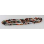 A large graduated semi-precious agate bead necklace, having large mottled cream oval bead to