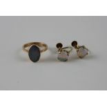 A 9ct. yellow gold and opal ring, set oval cabochon opal to centre, shank impressed "9ct",