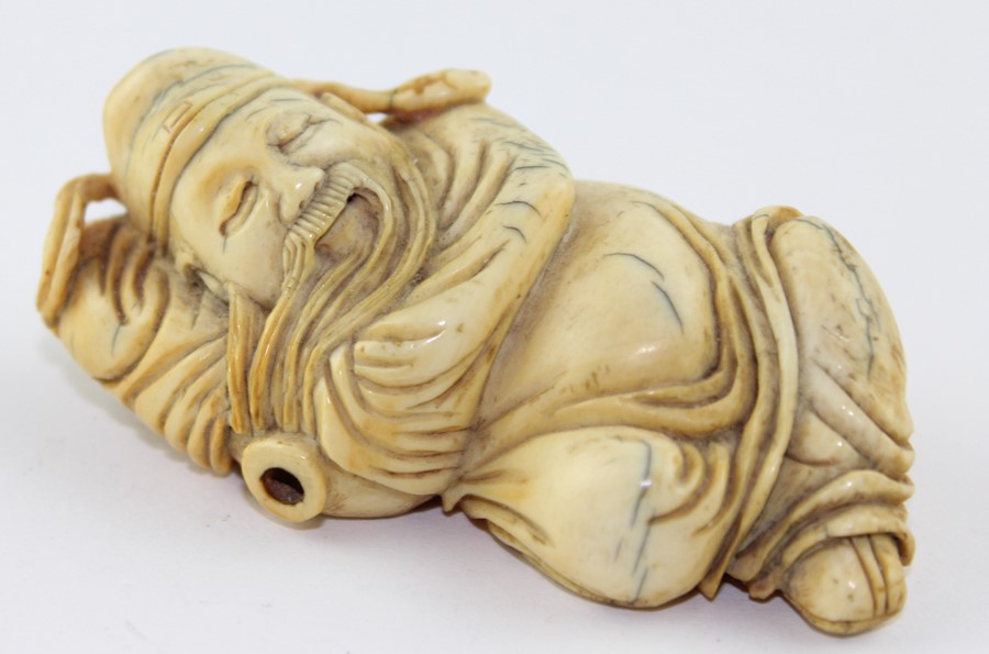 A late 19th century Chinese ivory Lohan, the recognisable figure in recumbent pose, 6.5 cm long - Image 5 of 5