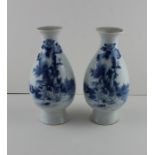 A pair of early 20th century Chinese porcelain vases, decorated with rabbits among foliage to side