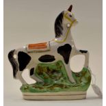 A 19th Century Staffordshire figure of a horse,