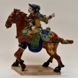 Glazed terracotta Japanese warrior on horse back,