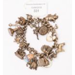 A sterling silver charm bracelet, set with multiple silver and enamelled charms, 104.39 grams / 3.