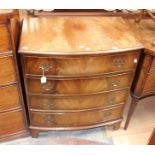 A bow fronted four drawer chest.