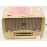 An Ultra radio, cream casing, purchased 21/02/1954, was working when last used,