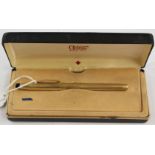 A Cross fountain pen, with rolled gold casing and a 14k gold nib,