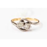 An 18ct gold two stone diamond dress ring,