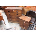 A large chest of drawers together with a small two drawer cupboard.