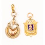 Football Medals: A 9ct gold, shield-shaped football medallion,