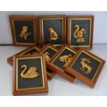 A collection of eight framed plaques featuring 24ct Gold plated animal and birds by artist Susan