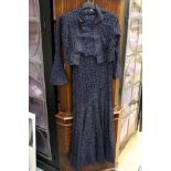A navy lace 1930's evening gown with a bolero jacket and belt cut on the bias, 1933,