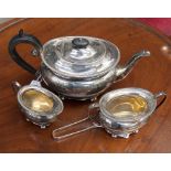 A George V silver three piece tea service, comprising teapot, milk jug and sugar bowl,