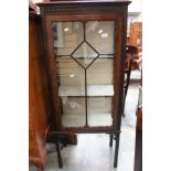 An Edwardian display cabinet, glazed ¾ panels,