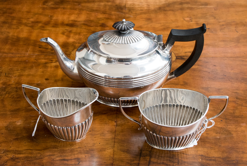 A late Victorian matched silver three piece tea service, the teapot hallmarked for Sheffield 1896,