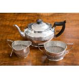 A late Victorian matched silver three piece tea service, the teapot hallmarked for Sheffield 1896,