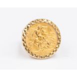 A 1911 half sovereign ring set into a 9ct gold demountable casing, gross weight approx 9.