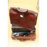 A collection of four various leather and faux leather suit and brief cases (4)