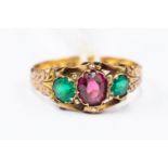 A Victorian paste set ring, 22 ct gold, size L, set with green and purple paste, dated 1873,