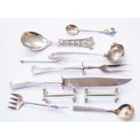 A collection of North European silver including a carving knife and fork,